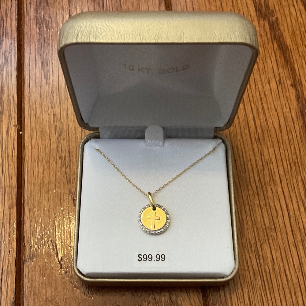 pretty gold cross necklace, new condition, chain is 18 inches